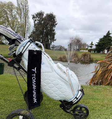 a golf bag with a black golf towel